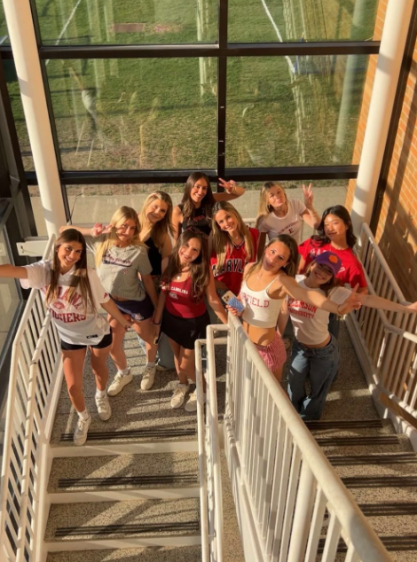 Senior girls posing in the staircase